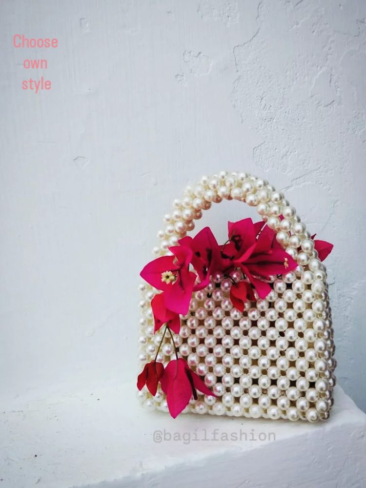 Handmade ivory pearl top-handle bag with bougainvillea flowers