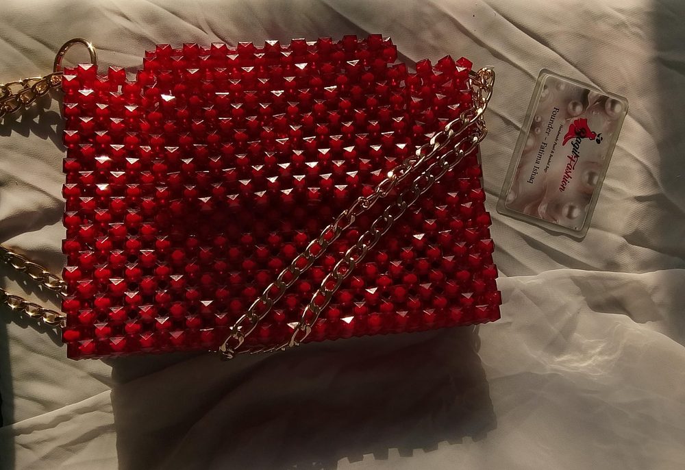 Handmade red crystal beaded bag with the Bagilfashion founder card